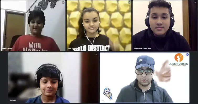 A live Junior Coderz online coding class with four students and an engineer instructor
